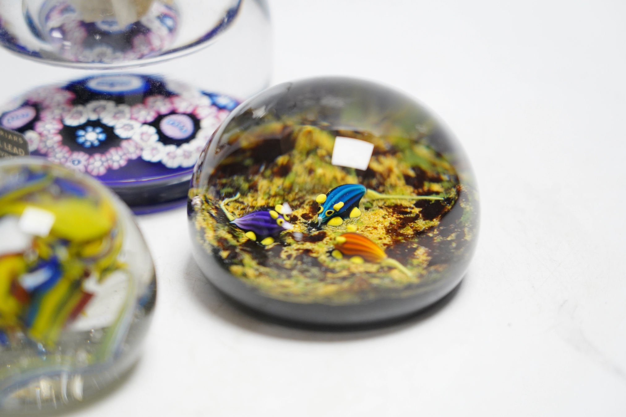 A collection of boxed Whitefriars and Caithness paperweights and others (10)
